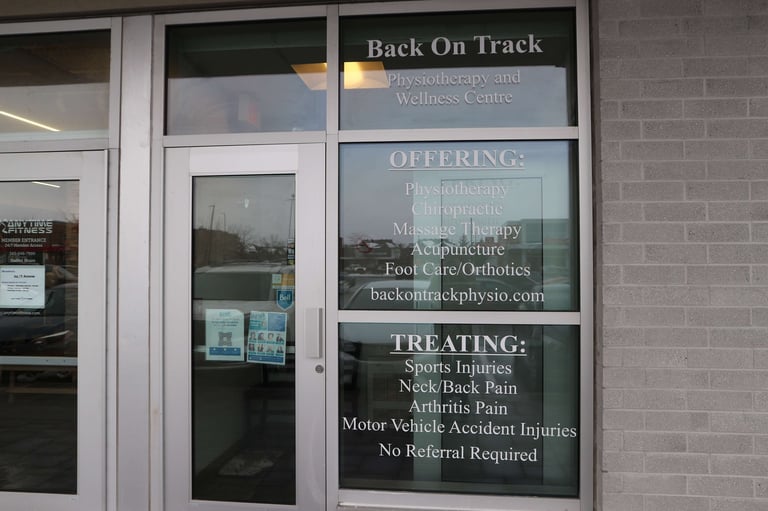 Storefront window for Back On Track Physiotherapy and Wellness Centre displaying services offered and treatments provided