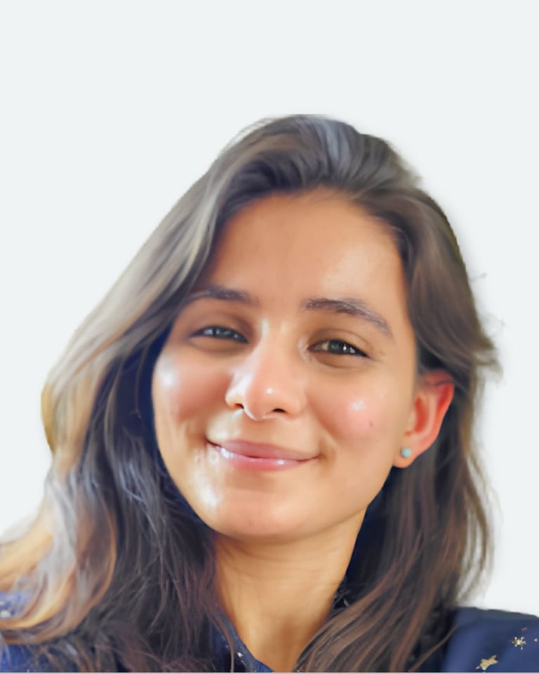 Young woman with long dark hair smiling at camera against white background, professional headshot style portrait