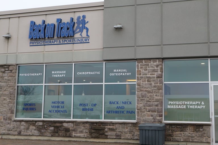Exterior of BioHealth physiotherapy and sports injury clinic with blue signage and storefront windows listing services offered.